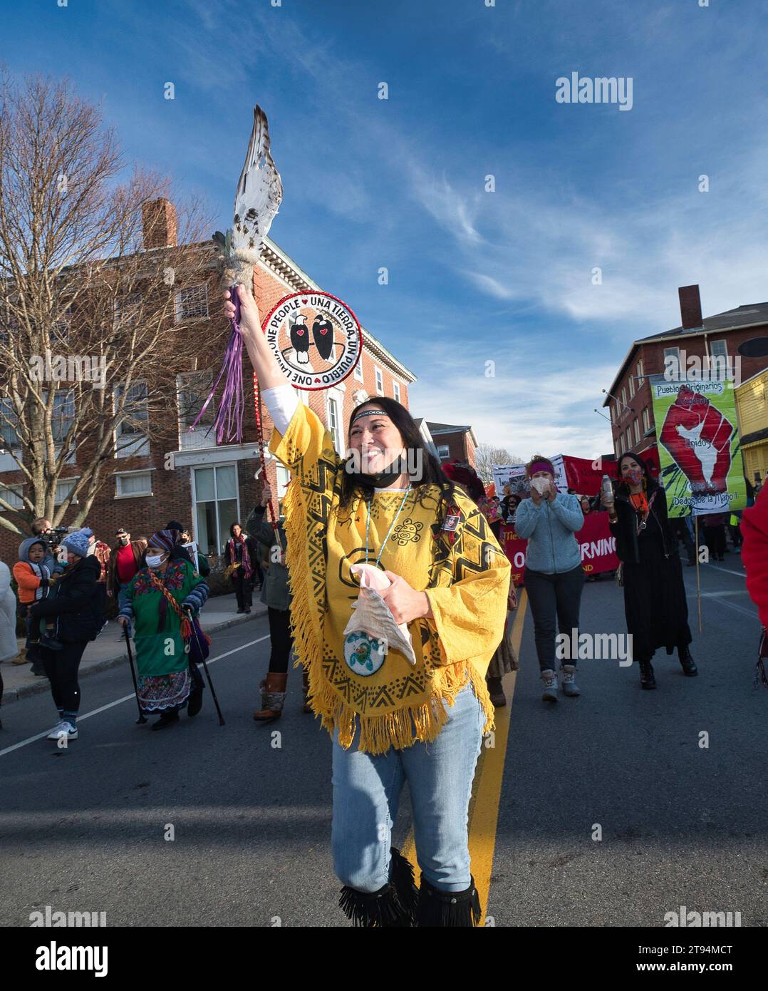 Plymouth, Massachusetts, USA  November 25, 2021 National Day of Mourning sponsored by United American Indians of New England ceremony, protest and march in Plymouth, Massachusetts held every year on Thanksgiving.  The group of over 1000, mostly native Americans,   gathered at the Massasoit statue, on Cole Hill , then marched through the town of Plymouth to the Plymouth Rock.  ChaliÕNaru Boprike  of the Taino tribe, playing a conch shell and dancing through Plymouth during the parade.  (Rick Friedman) Stock Photo