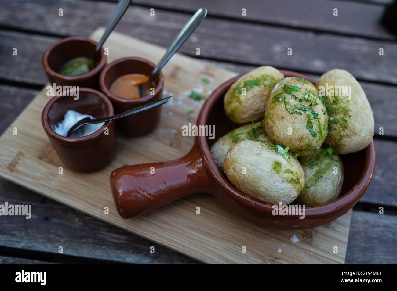 Traditional papas arrugadas con mojo picon at The Lagomar Museum, also known as Omar Sharif's House, unique former home incorporating natural lava cav Stock Photo