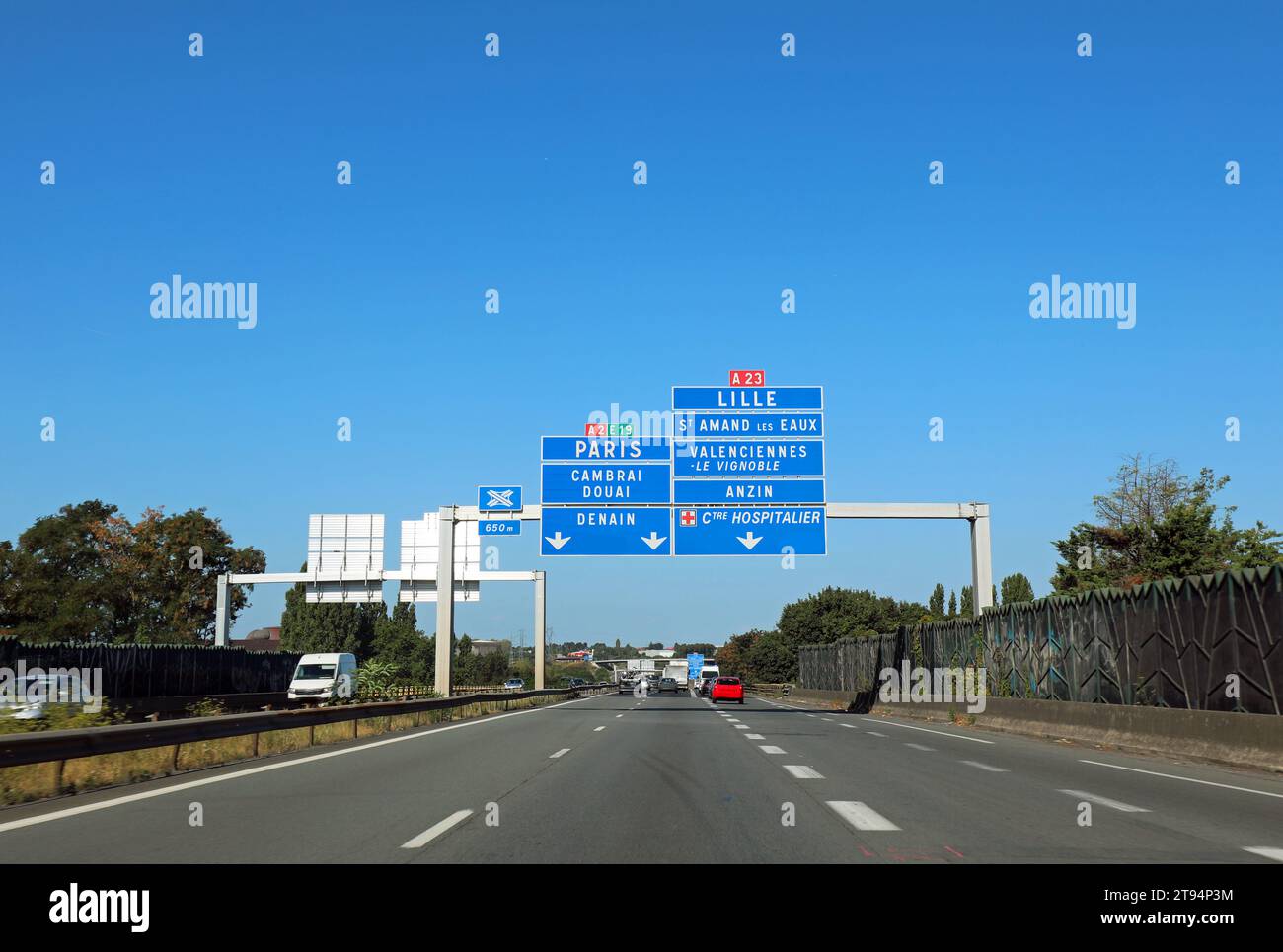 large road sign with the French locations to reach the city of Paris or  other places Stock Photo