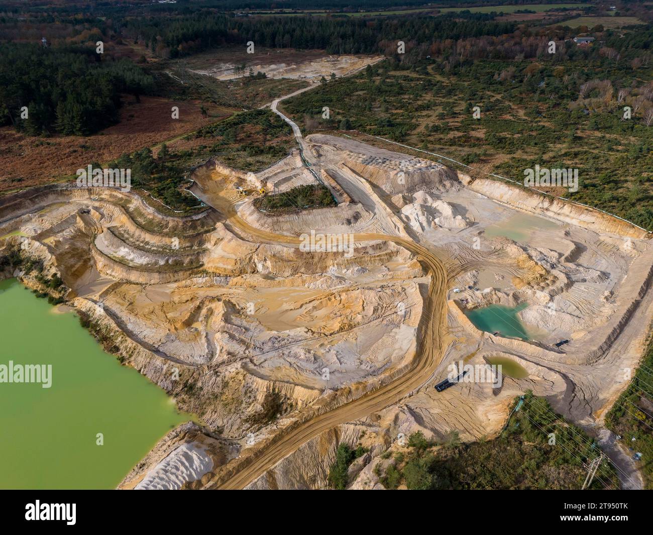 Wareham, Dorset, UK.  22nd November 2023.  Aerial view of the Heidelberg Materials Aggregates quarry at Hyde near Wareham in Dorset.  The quarry produces and distributes aggregates which include crushed rock, sand and gravel for the construction industry.  Picture Credit: Graham Hunt/Alamy Live News Stock Photo