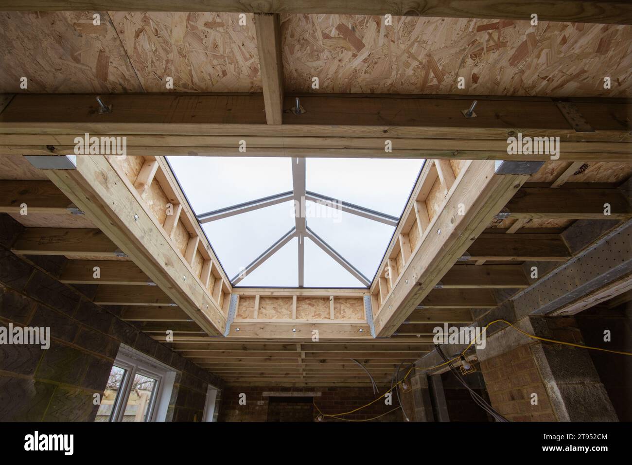 Wooden joists and lantern on new flat roof building extension February