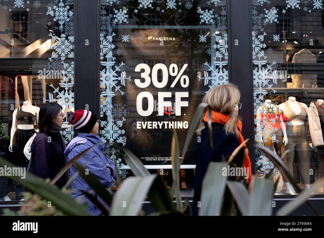 Shoppers pay attention on the discount notice for upcoming Black
