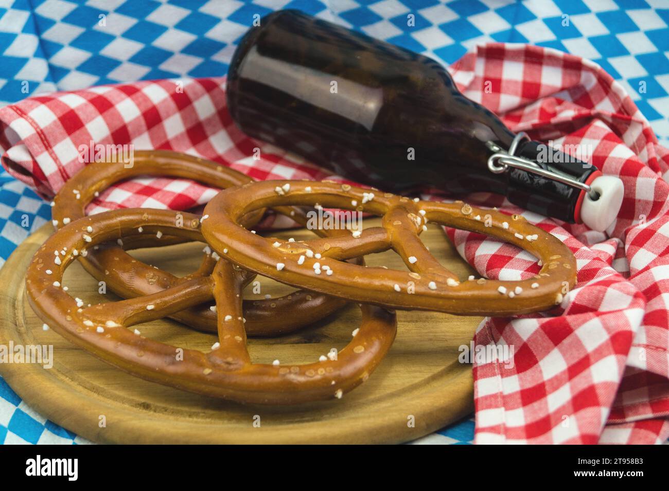 Bavarian pretzel, beer bottle, Oktoberfest in Munich, Germany, Bavaria, Muenchen Stock Photo