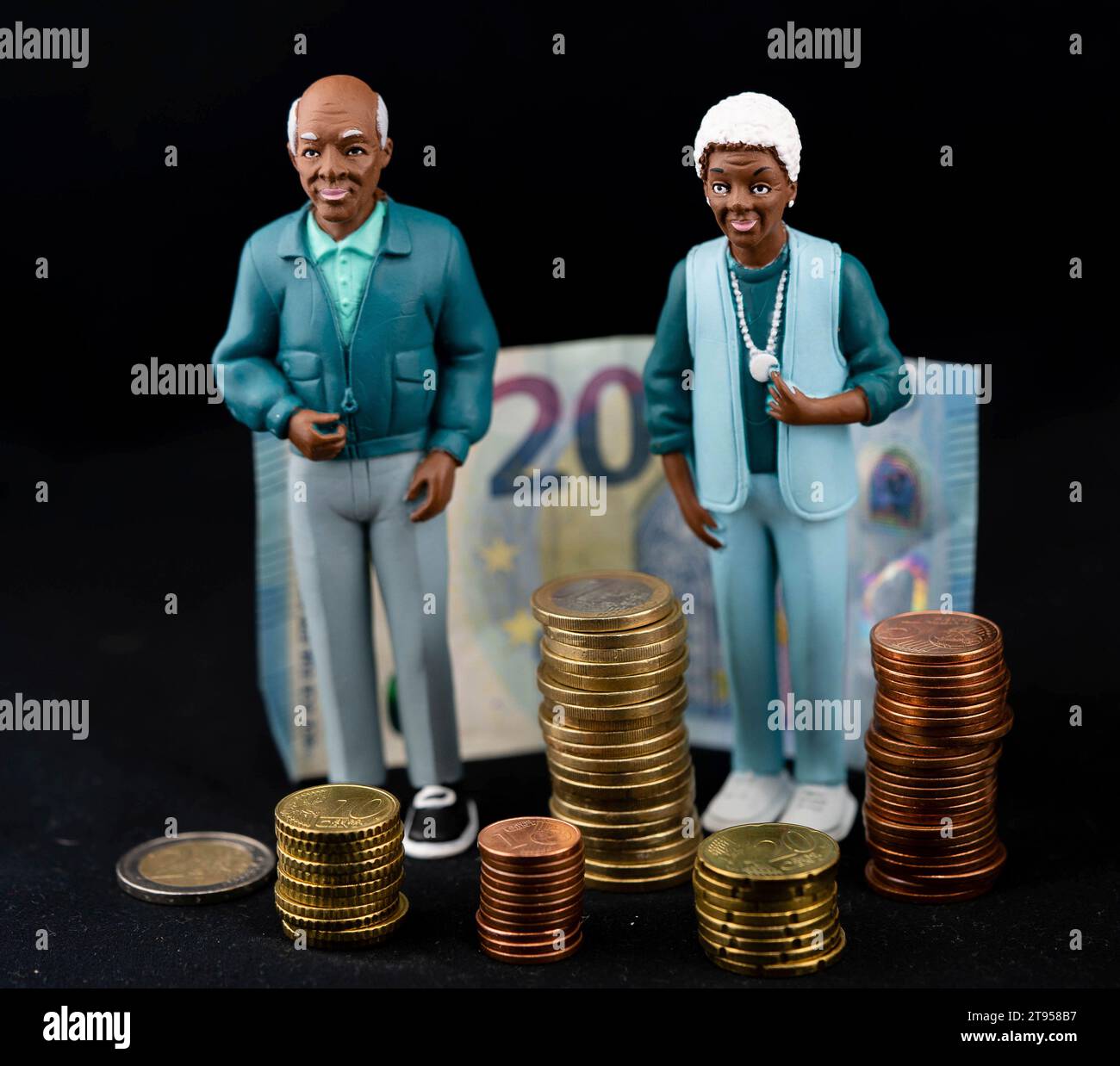 black senior couple with coin piles an Euro bill, old-age poverty Stock Photo