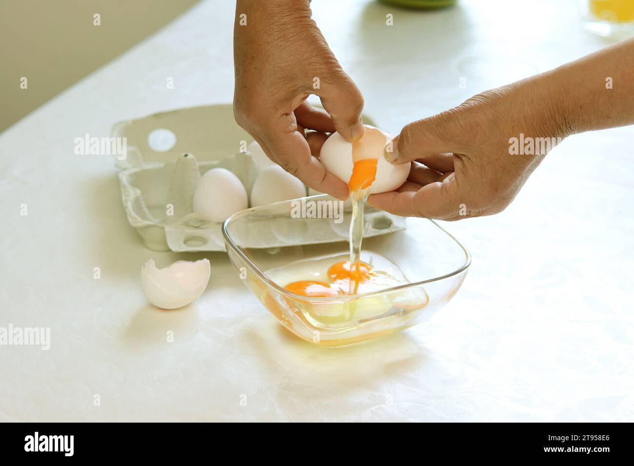 breaking an egg Stock Photo Alamy