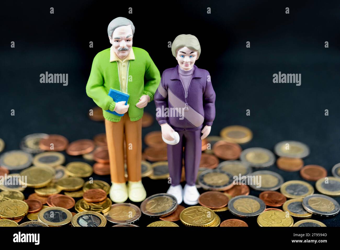 senior couple with Euro coin, old-age poverty Stock Photo