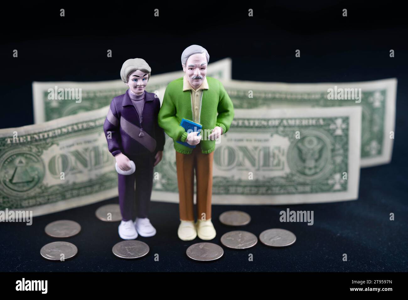 senior couple with 1 Dollar bills and cents, old-age poverty Stock Photo