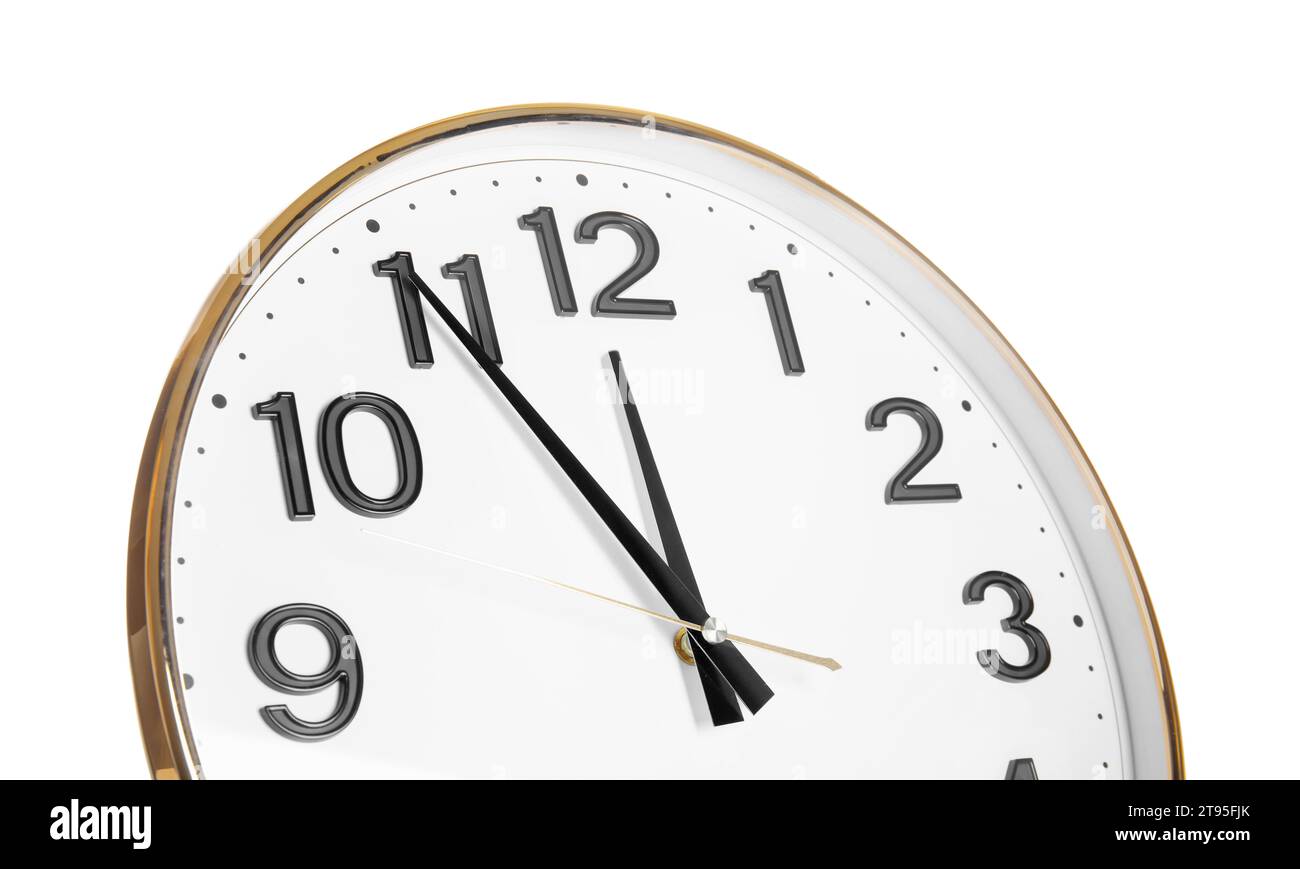 Clock showing five minutes until midnight on white background, closeup