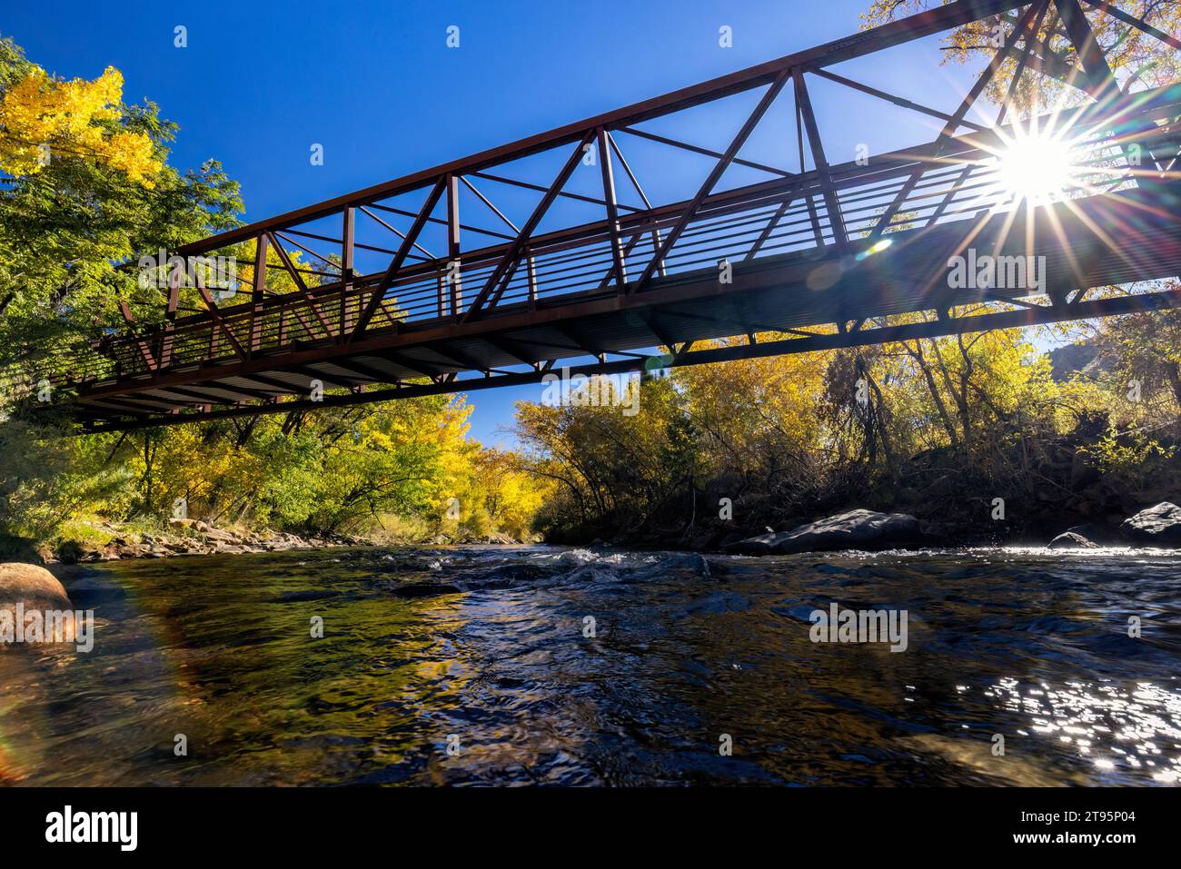 Bridge over Clear Creek in autumn - Golden, Colorado, USA Stock Photo