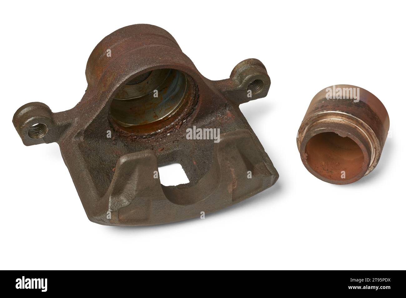 old disc brake caliper and piston, rusty and worn out components in the
