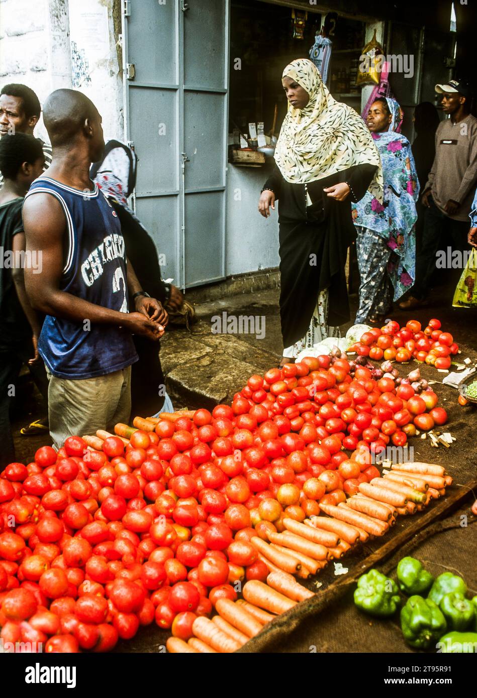 Muslim women shopping at the Darajani Market, the main market in Stone Town, Zanzibar, East Africa Stock Photo