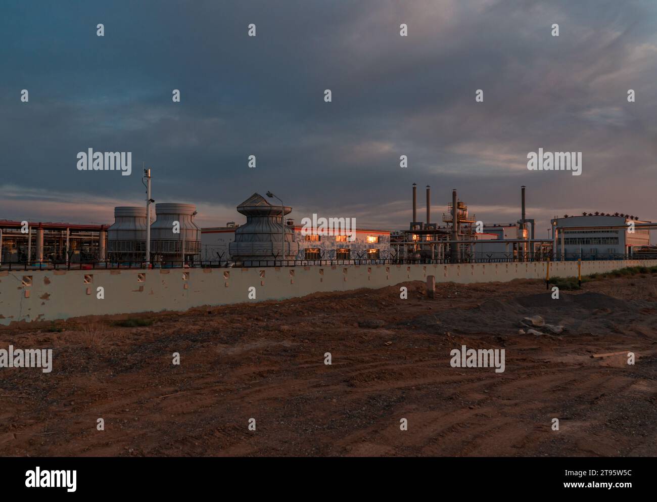 Oil and gas resource processing plant under sunset in the evening Stock ...