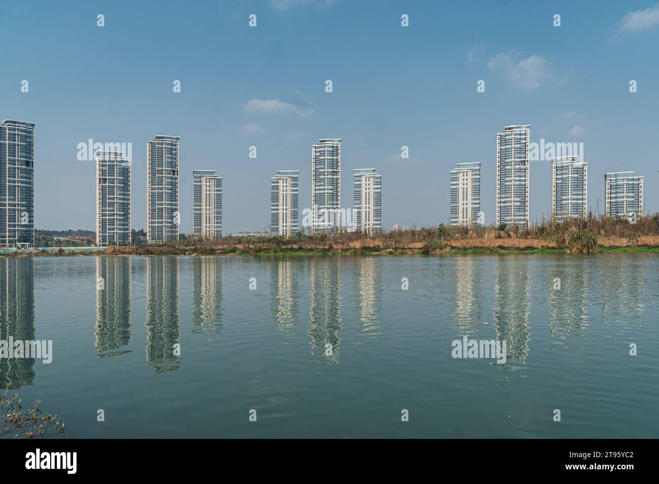 Reflection of high-rise buildings by the lake Stock Photo - Alamy