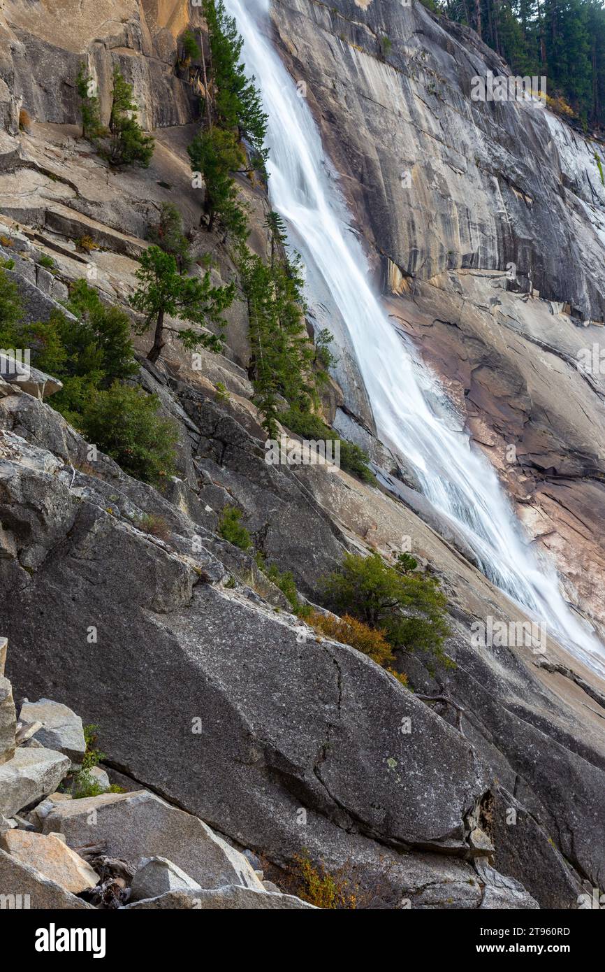Scenic Nevada Fall Vertical Portrait Low Autumn Water Flow Granite Rock Cliff. Hiking John Muir Trail Yosemite National Park Sierra Nevada California Stock Photo