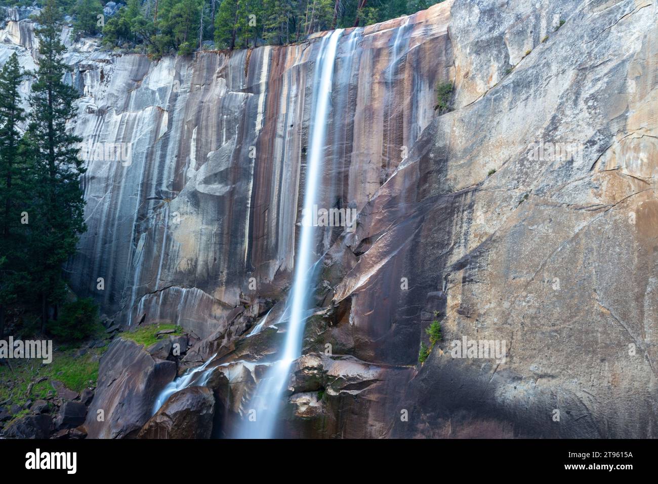 Scenic Vernal Fall, Low Autumn Water Flow Polished Granite Rock Face. Hiking Famous John Muir Trail Yosemite National Park Sierra Nevada California US Stock Photo
