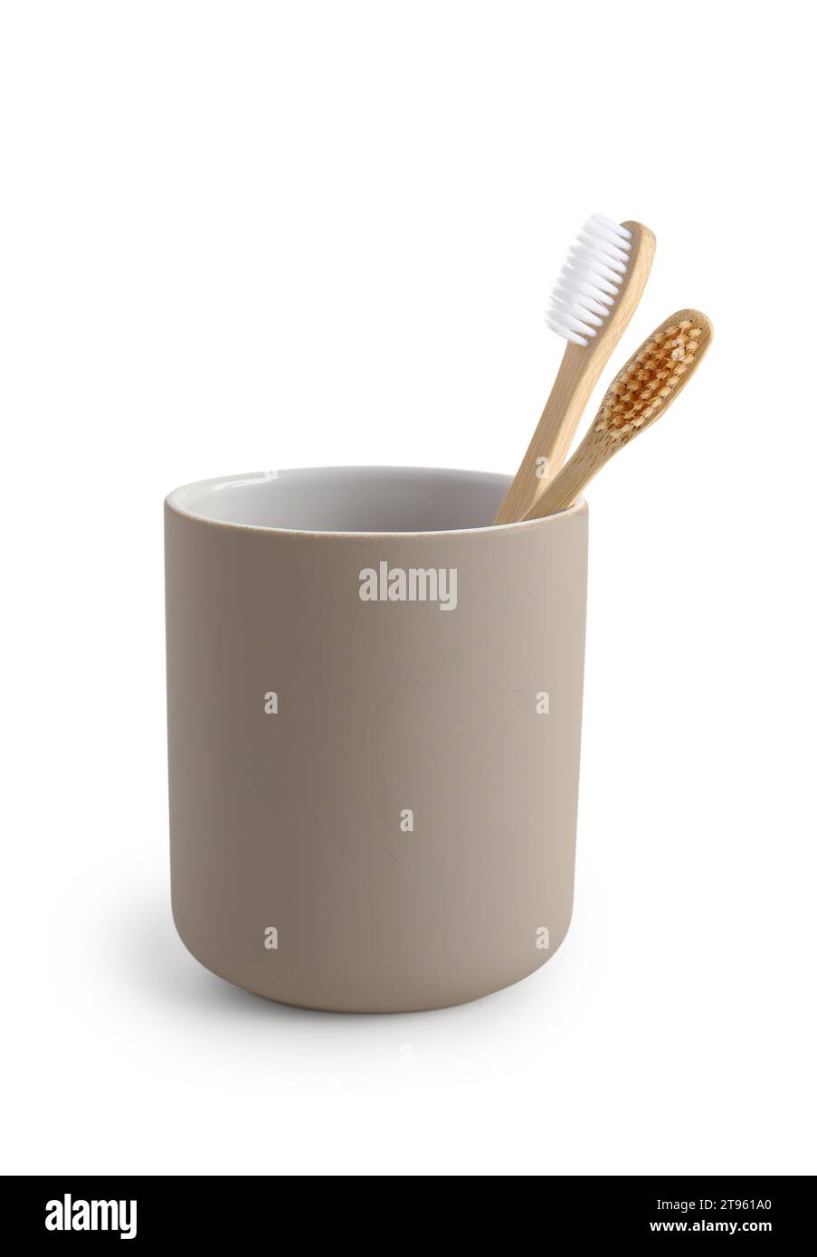 Bamboo tooth brushes in holder on white background Stock Photo - Alamy
