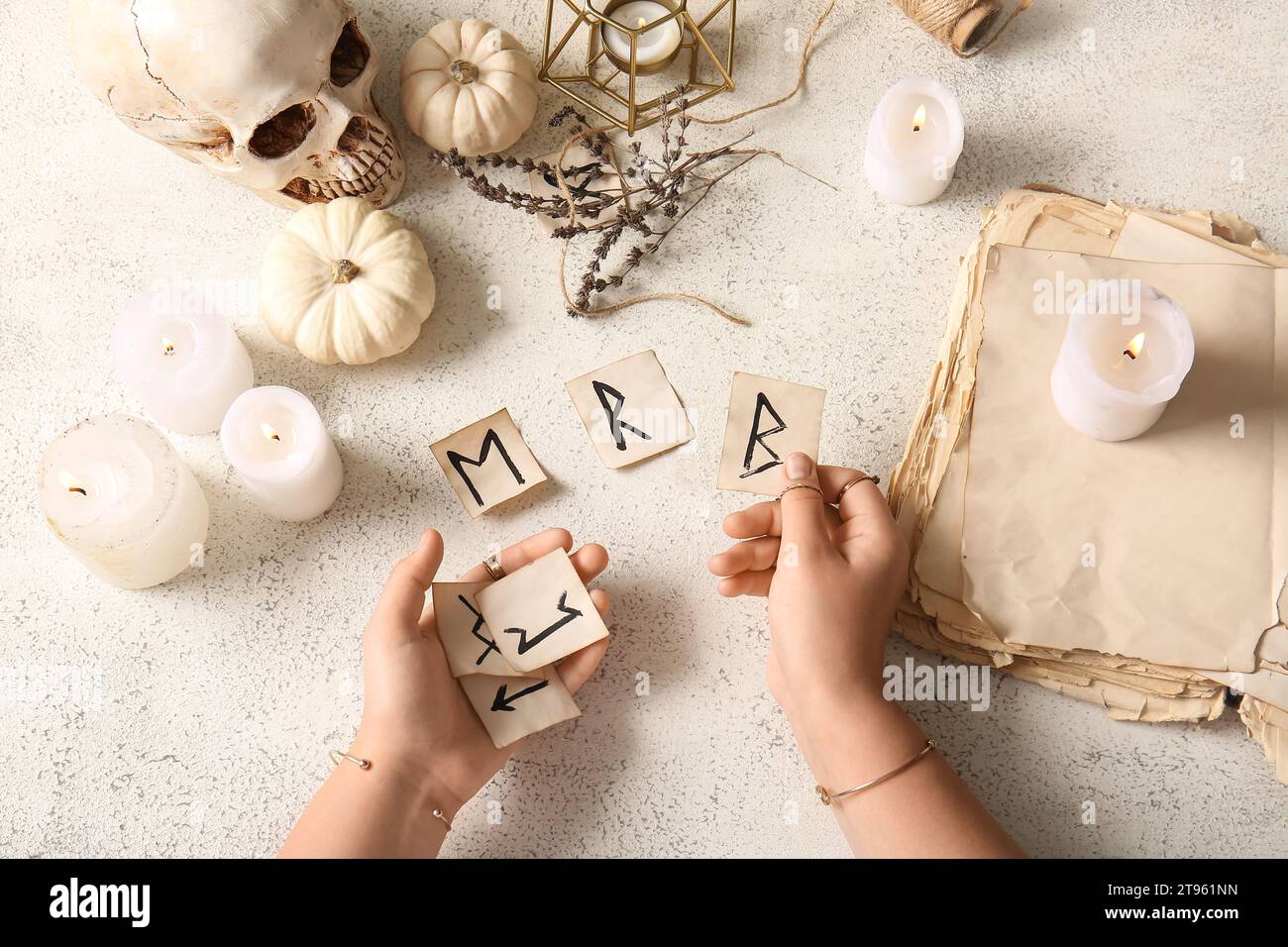 Witch with runes and magic attributes on light grunge background Stock ...