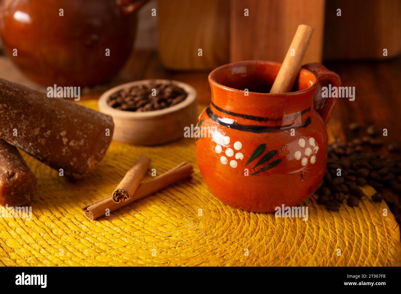 Cafe de Olla, Mexican-style coffee prepared with roasted and ground coffee beans, cinnamon and piloncillo. Traditional recipe prepared in a clay pot a Stock Photo