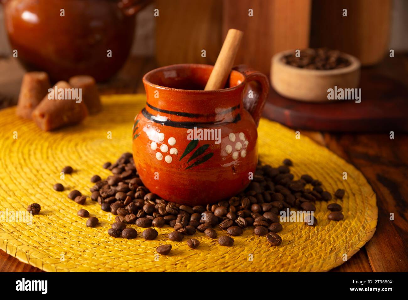Cafe de Olla, Mexican-style coffee prepared with roasted and ground coffee beans, cinnamon and piloncillo. Traditional recipe prepared in a clay pot a Stock Photo