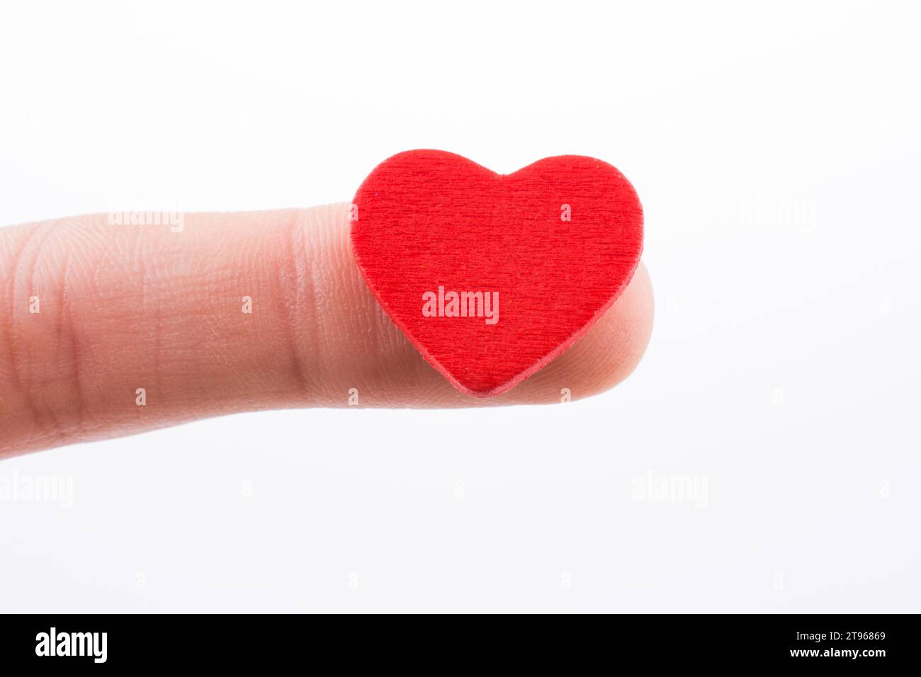Hand holding a red heart Stock Photo - Alamy
