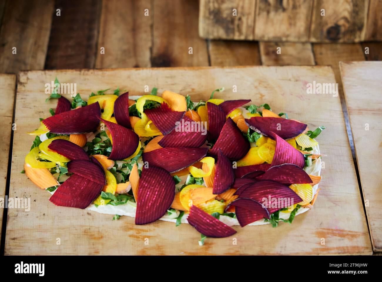 A vegan pizza with beetroot and herbs at the Oranjezicht Food Market in Cape Town, South Africa Stock Photo