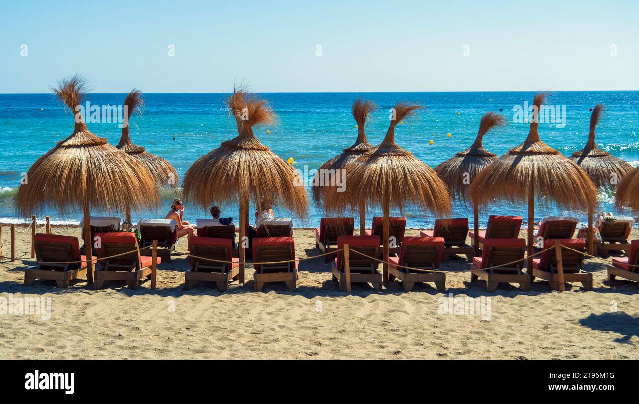 Beach umbrellas on the sand Stock Photo