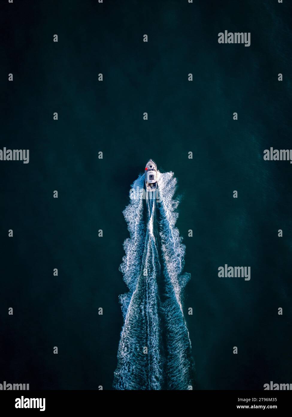 Aerial view of speed motor boat on open blue sea Stock Photo - Alamy
