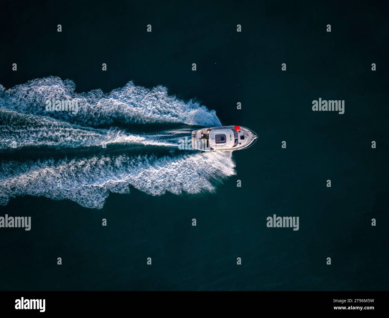 Aerial view of speed motor boat on open blue sea Stock Photo - Alamy