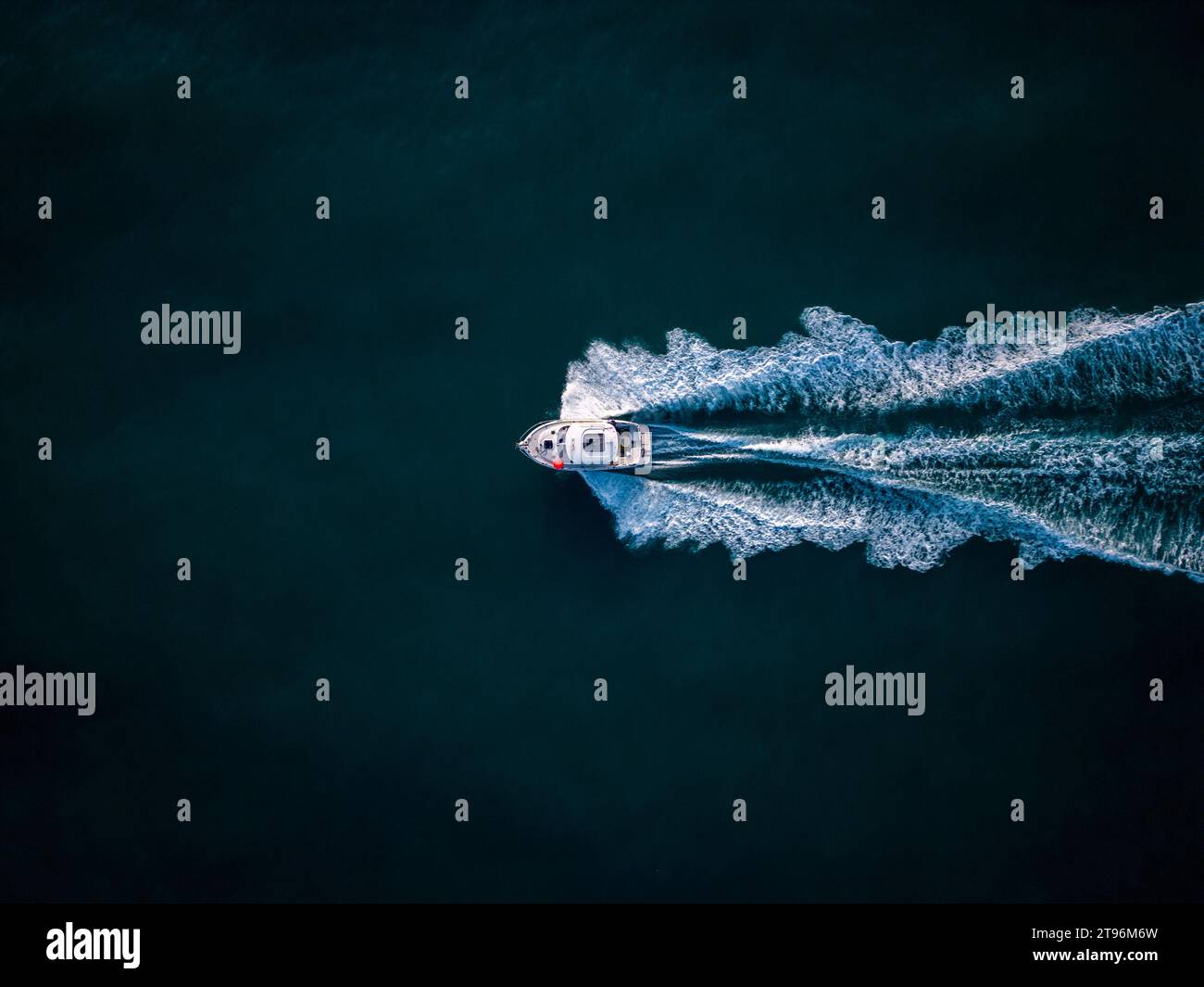 Aerial view of speed motor boat on open blue sea Stock Photo - Alamy