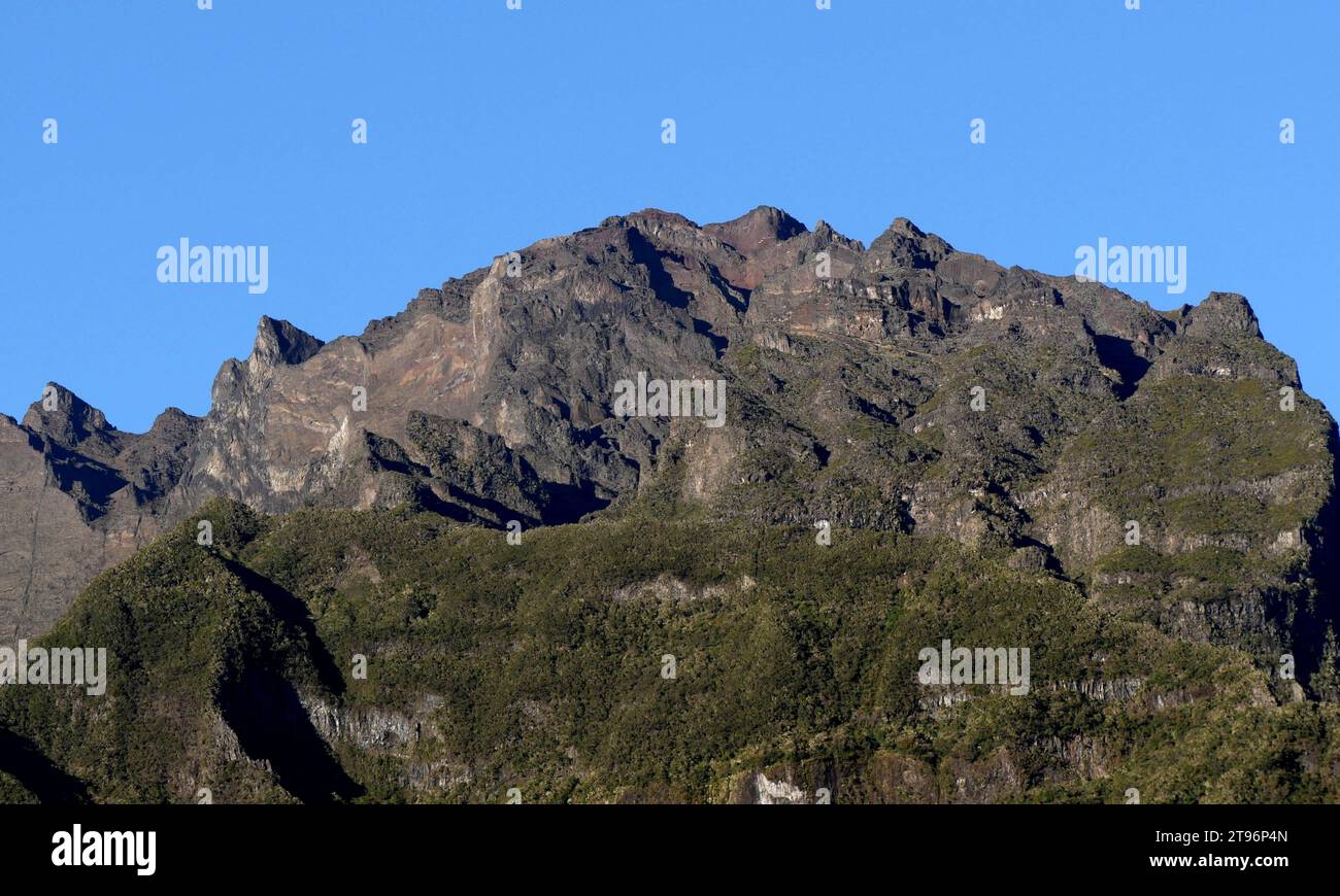 Piton des Neiges summit seen from Cilaos, Reunion. Highest volcanic mountain in the Mascarene islands. Iconic hike start in Le Bloc, Cilaos Stock Photo
