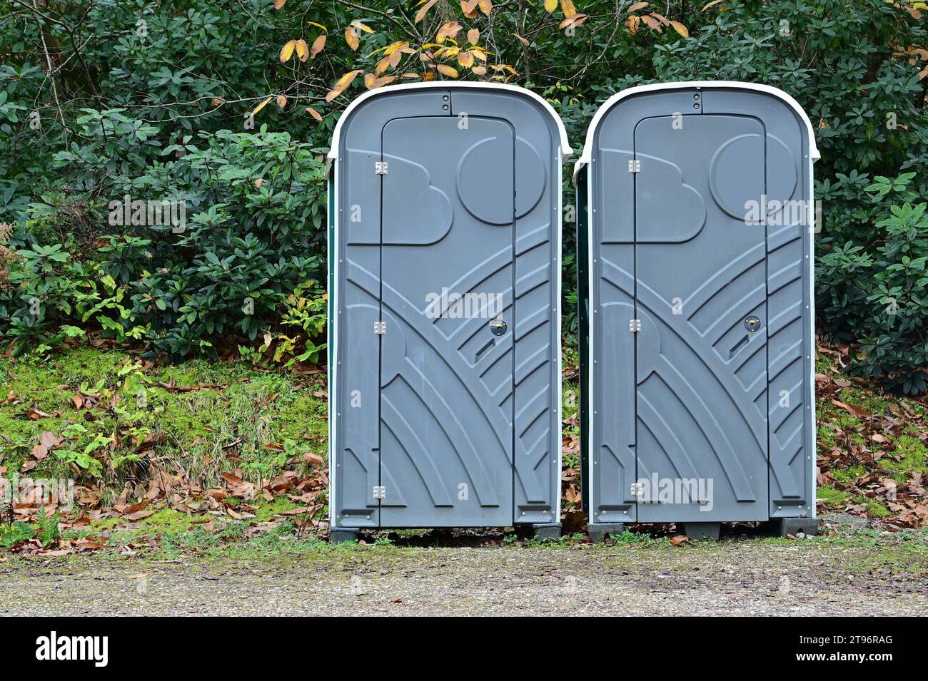 Portable toilets in woodland in the UK. Stock Photo