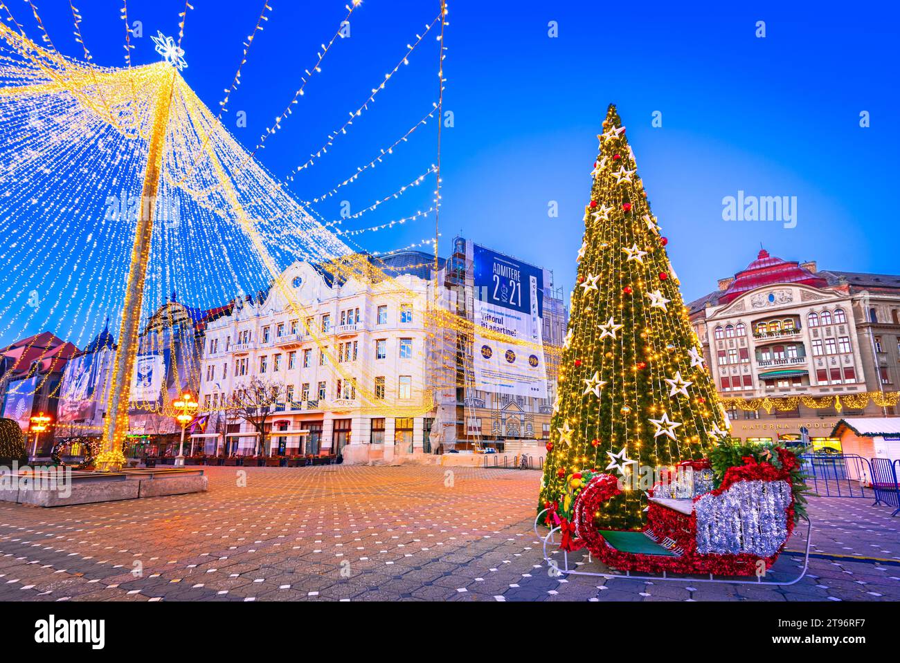 Timisoara, Romania - December 4th 2021. Twilight view of a Christmas Market celebration in Victory Square, Timisoara. Stock Photo