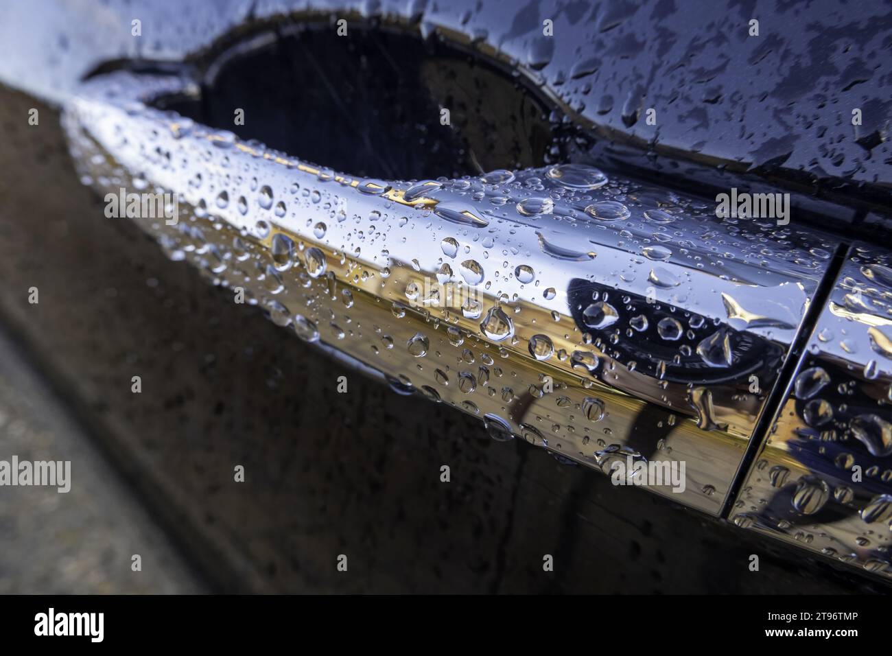 Detail of a modern electric car wet by the rain on a winter day Stock Photo