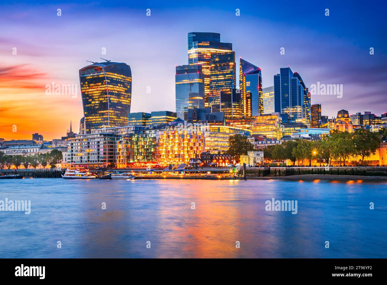 London, United Kingdom. Skyline view of the famous City of London during blue hour. View includes Thames River, skyscrapers, office buildings and beau Stock Photo