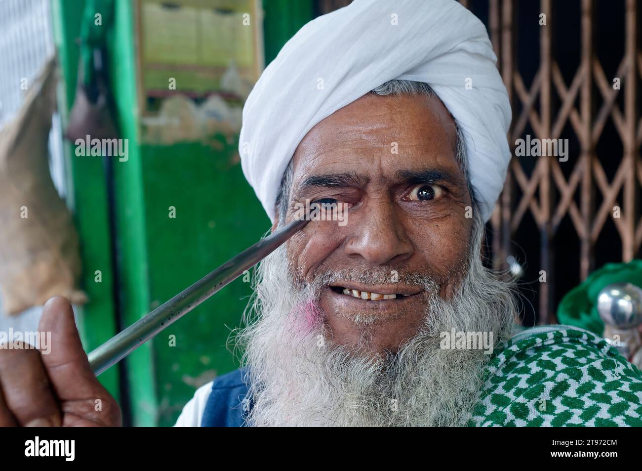 A crazed looking fakir, a wandering Muslim ascetic performing bizarre ...