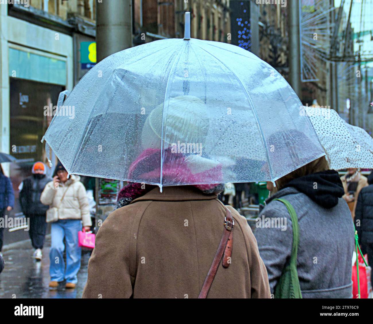 Glasgow, Scotland, UK. 23rd November, 2023. UK Weather:  Rain saw a proliferation of umbrellas in the city . Credit Gerard Ferry/Alamy Live News Stock Photo