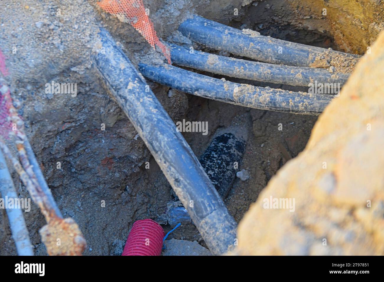 Cables in the trench. High voltage black cables in the trench. Concept ...