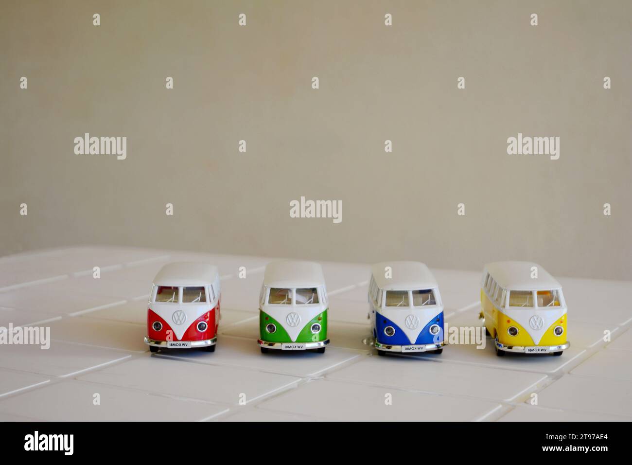 Van. Diecast, Iron miniature of vans of various colors, Brazil, South America, front view, selective focus on white table on white background Stock Photo