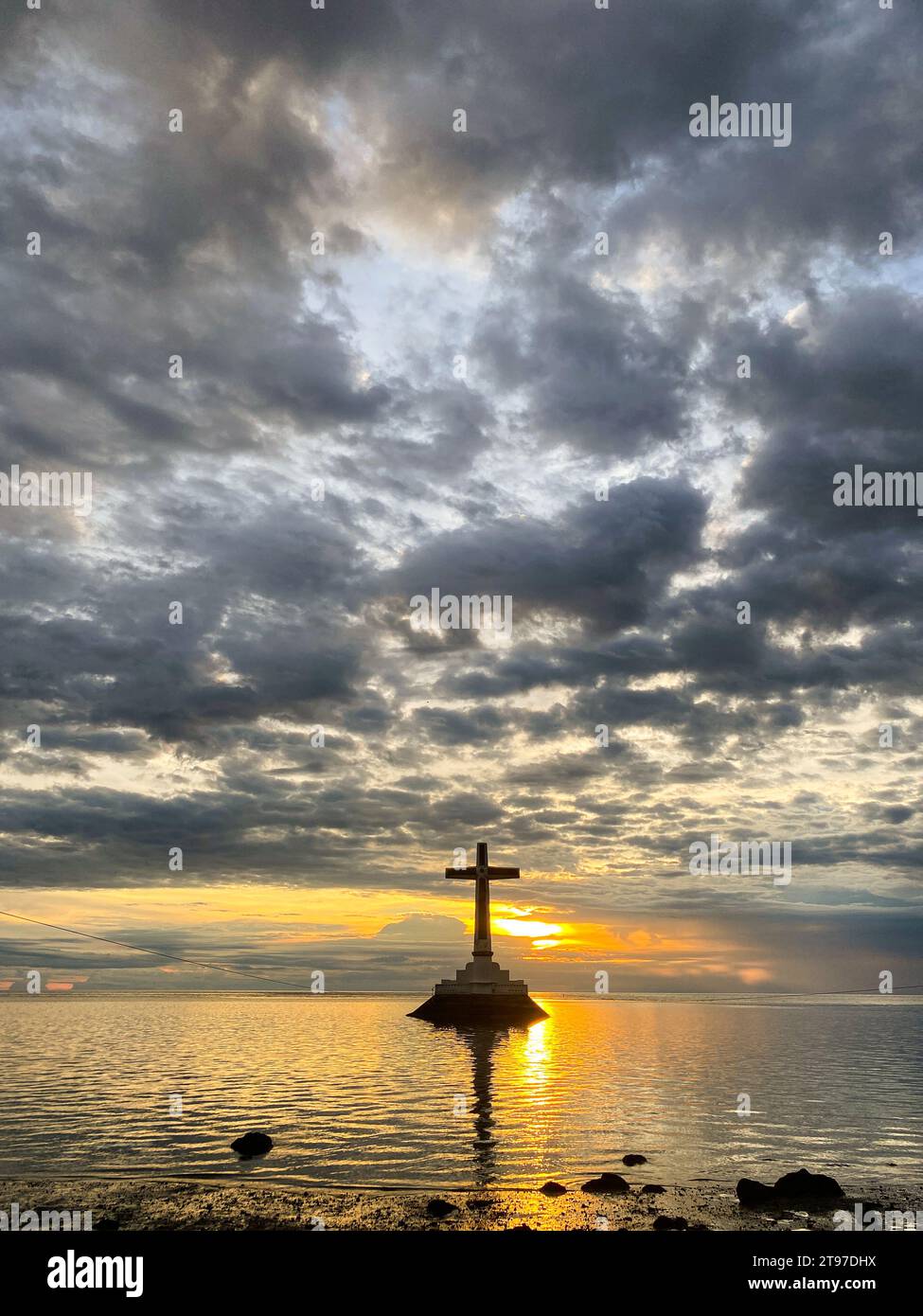 Sunset over the Sunken Cemetery. Beautiful sky and clouds. Camiguin Island. Philippines. Stock Photo