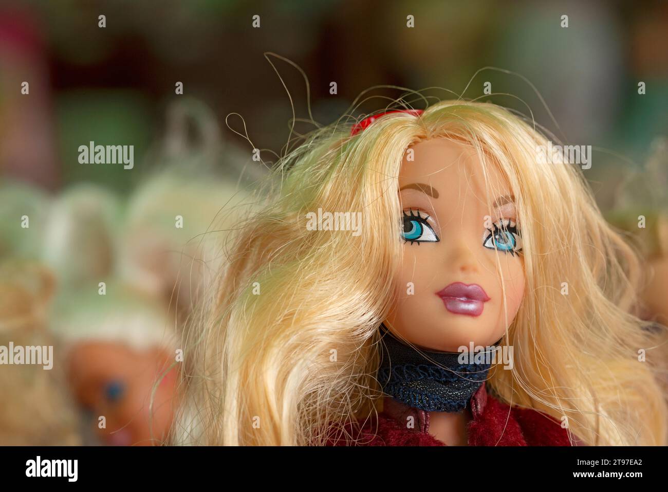 Close-up of a Doll Face with Blonde Hair Stock Photo