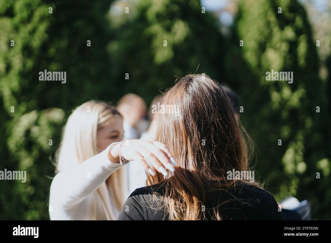 Students Collaborating Outdoors on University Project Stock Photo