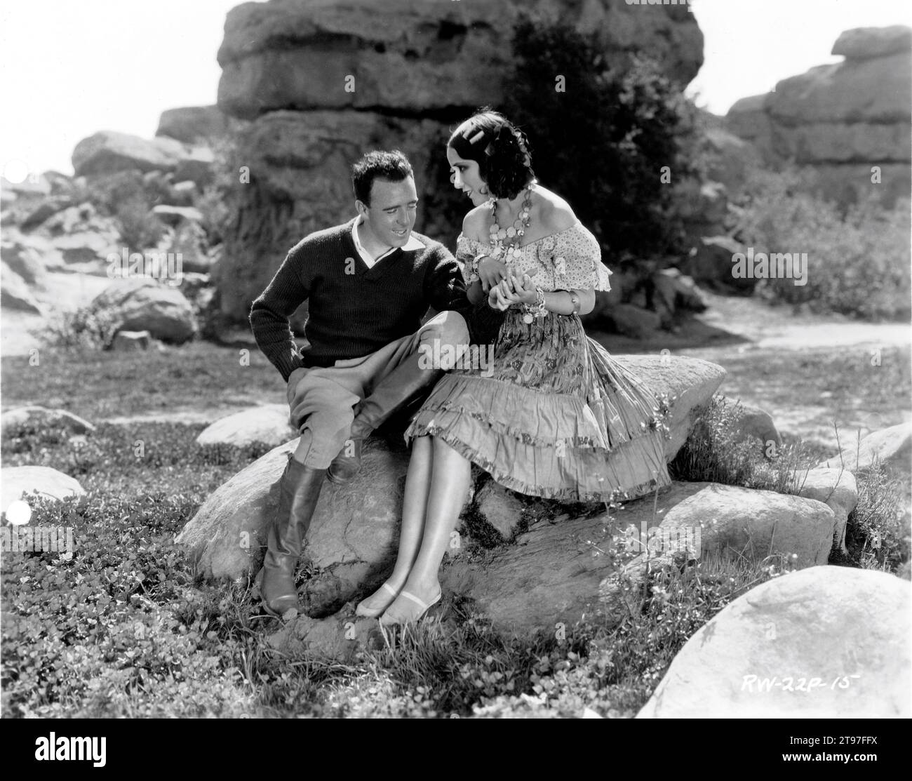 Director RAOUL WALSH and DOLORES DEL RIO on set location candid during  filming of THE LOVES OF CARMEN 1927 director RAOUL WALSH novel prosper  Merimee Fox Film Corporation Stock Photo - Alamy