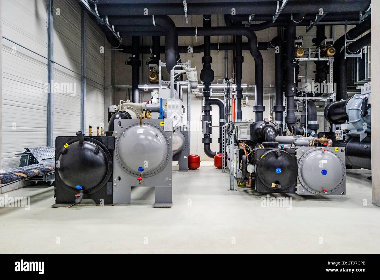 Machines and pipework in a factory for energy distribution Stock Photo