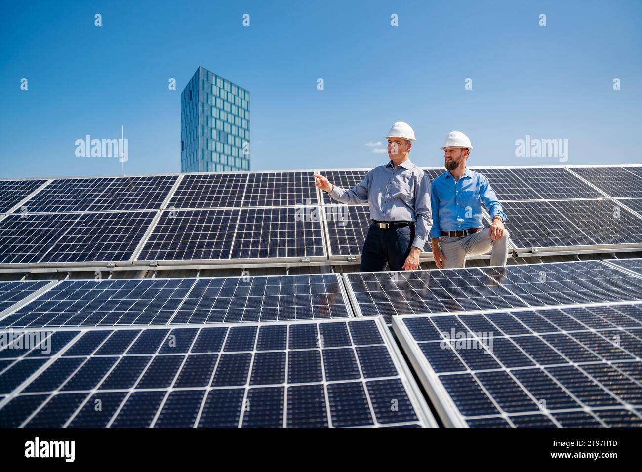 Two Engineers Installing Solar Panels On Roof Stock Photo - Download Image  Now - Solar Panel, Solar Energy, Solar Power Station - iStock