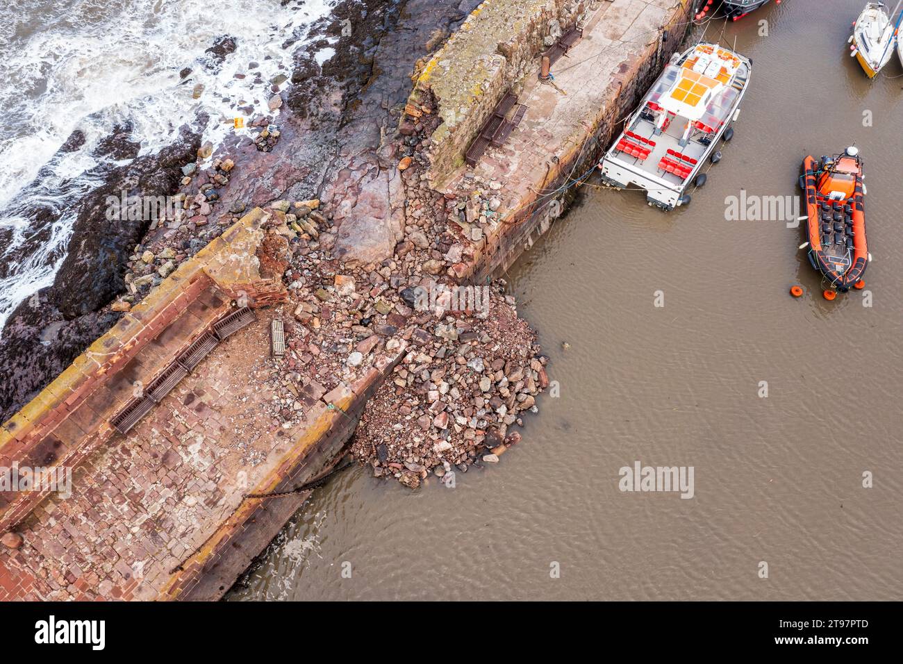 UK, Scotland, North Berwick, Aerial view of breach in harbor sea defence wall after Storm Babet Stock Photo