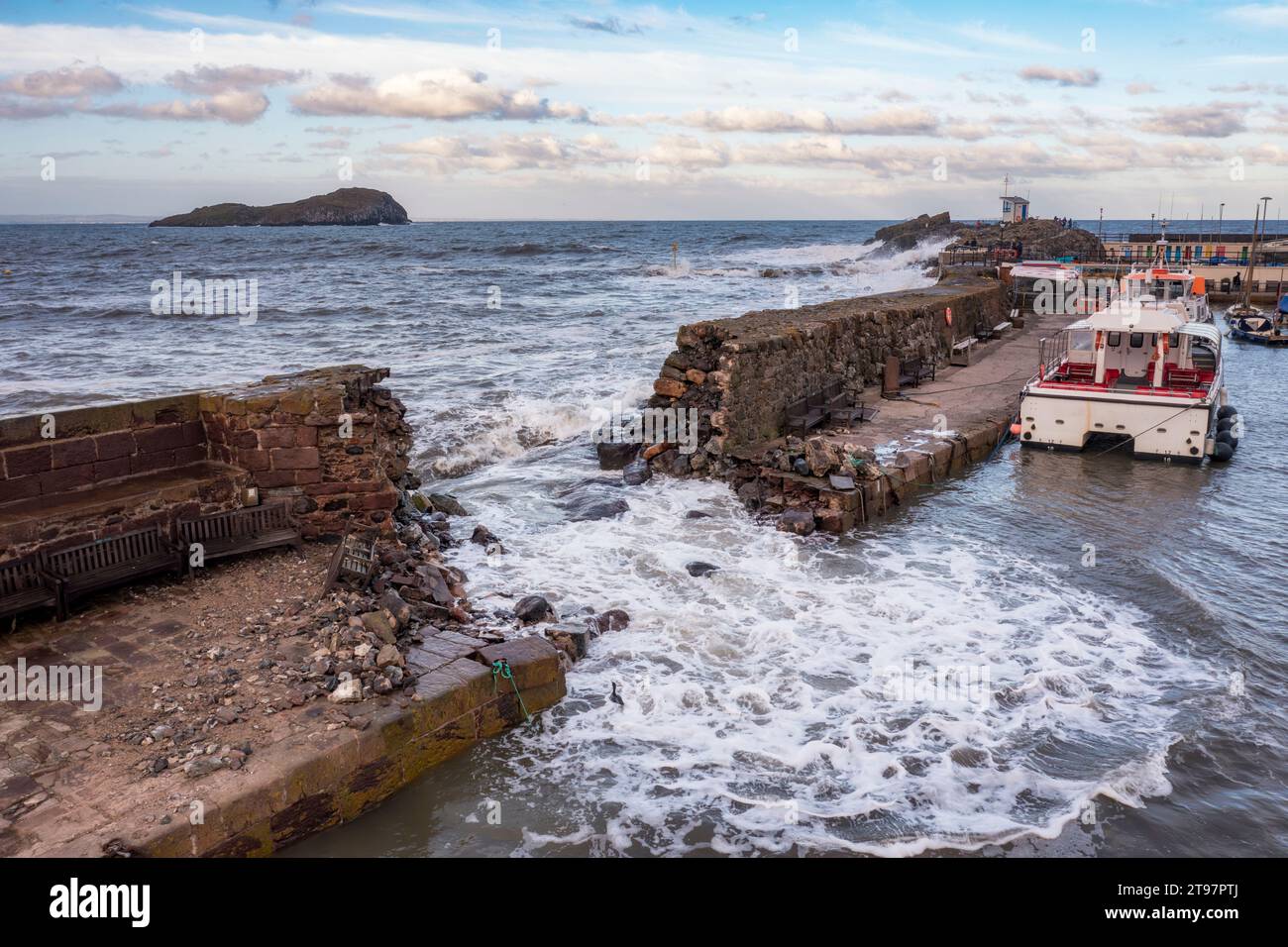 UK, Scotland, North Berwick, Breach in harbor sea defence wall after Storm Babet Stock Photo