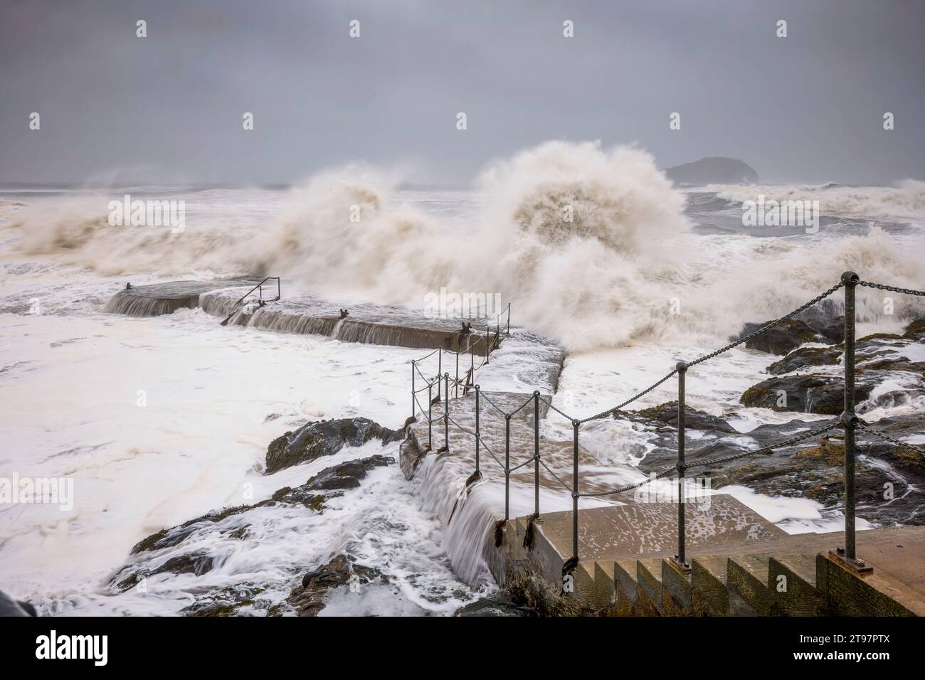 UK, Scotland, North Berwick, Waves splashing against coastal steps during Storm Babet Stock Photo