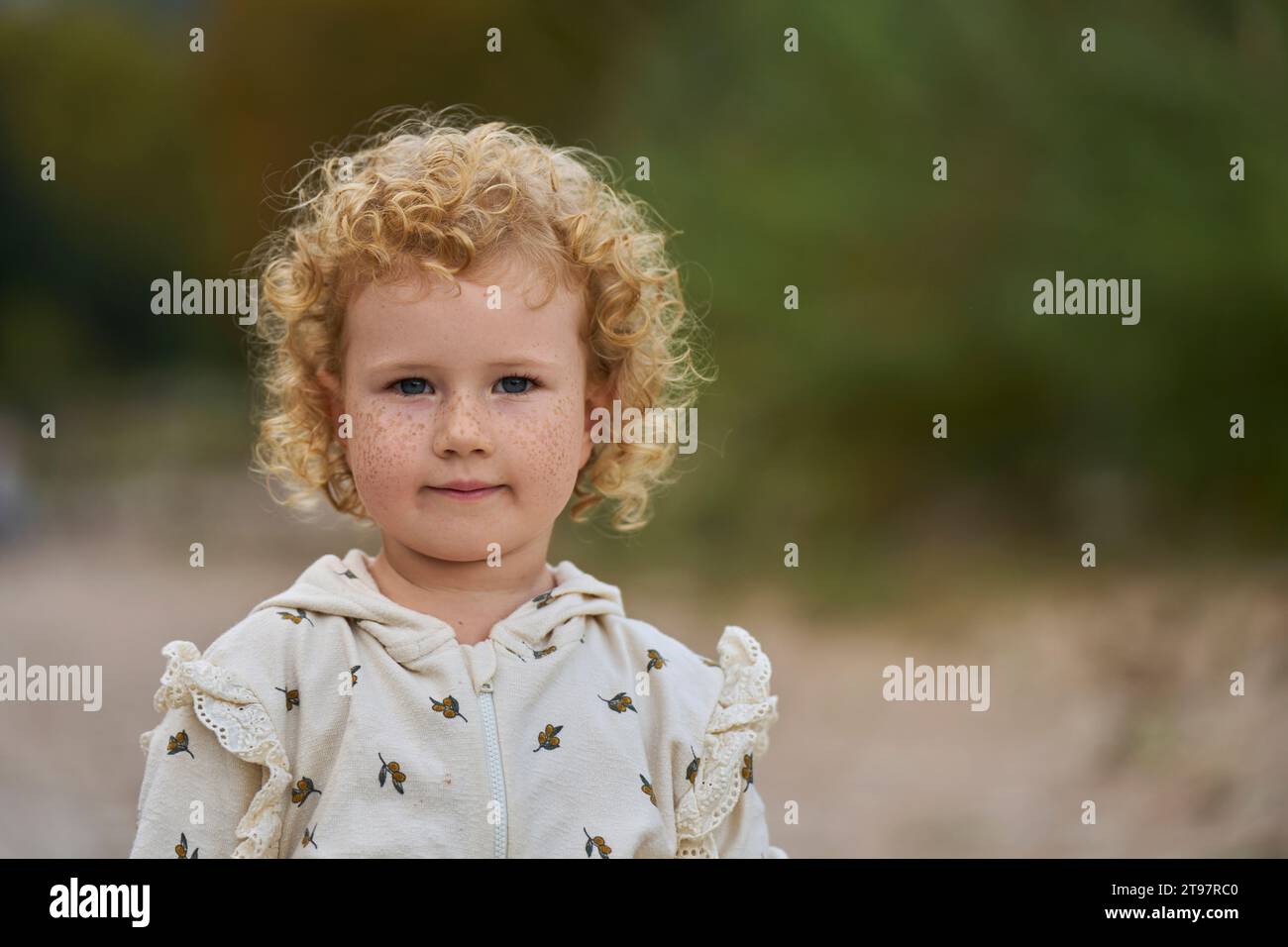 Curly blond girl hi-res stock photography and images - Alamy
