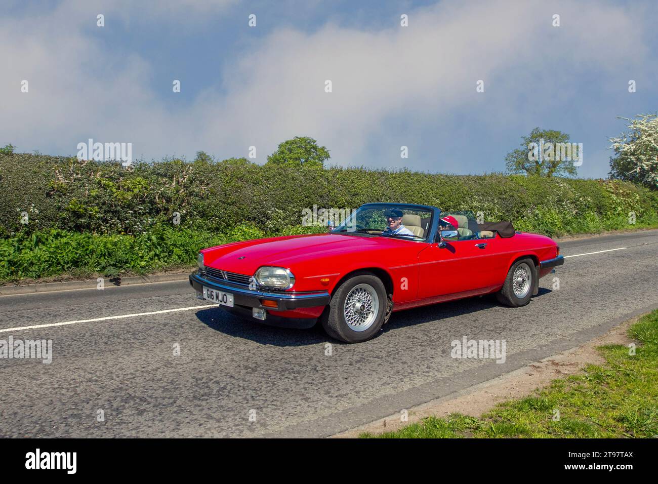 1990 90s nineties British Jagua rXj-S Convertible AutoV12 HE Auto Red Car Cabriolet Petrol 5343 cc; Vintage, restored British classic motors, automobile collectors,  motoring enthusiasts and historic veteran cars travelling in Cheshire, UK Stock Photo