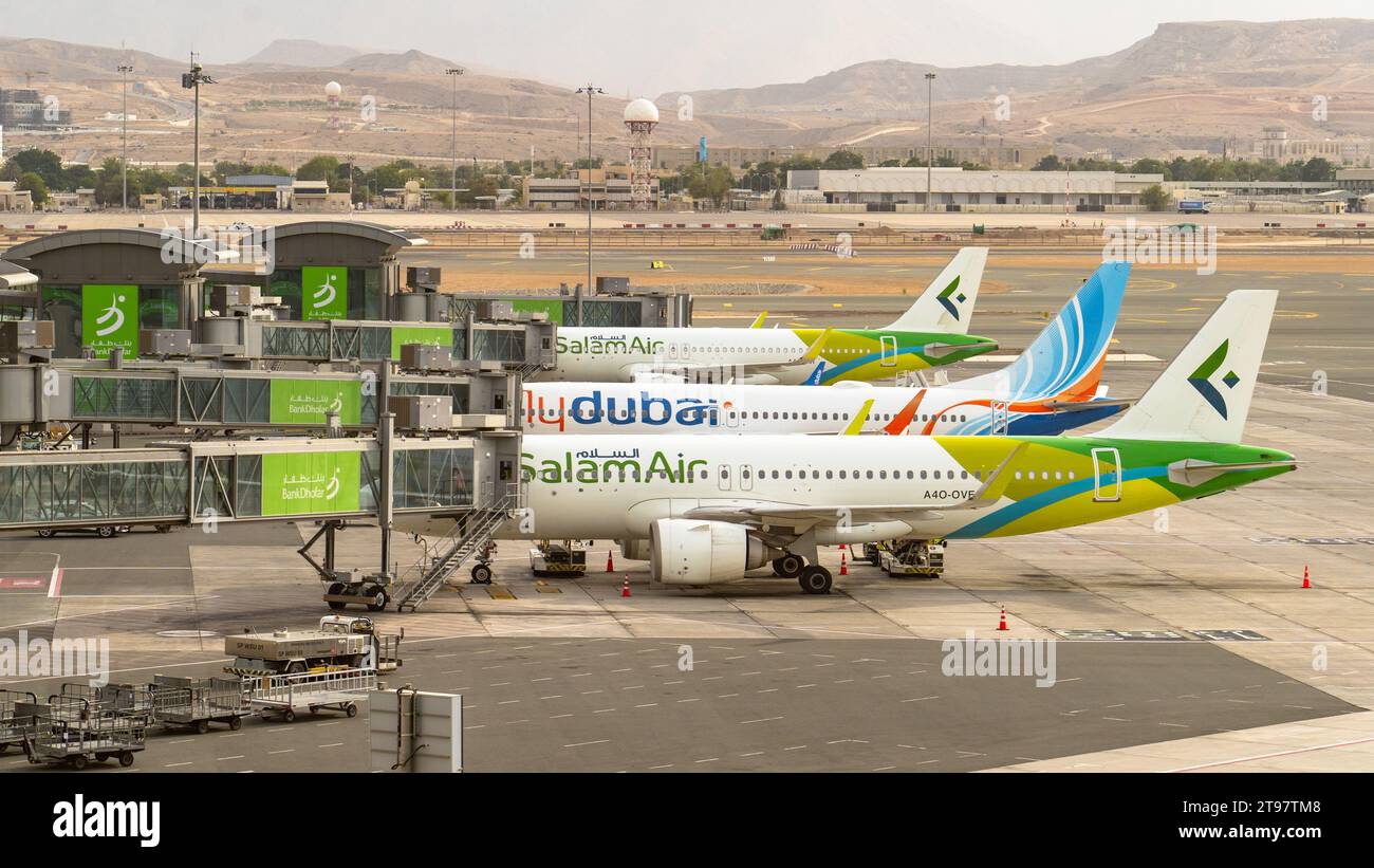 Muscat, oman November 21,2023 flydubai and salam air airplane getting